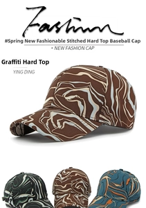 Detail showcasing four color variations of graffiti pattern hard top baseball caps