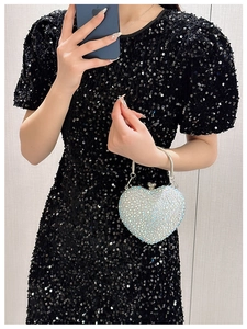 Sparkling silver heart-shaped evening clutch bag with rhinestones and metal handle