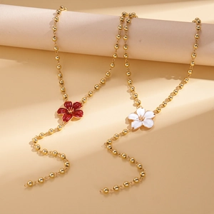 Elegant gold flower tassel sweater necklace with red and white enamel geometric charms