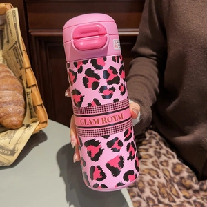 Detail of pink leopard print insulated mug with Glam Royal band and flip-top lid