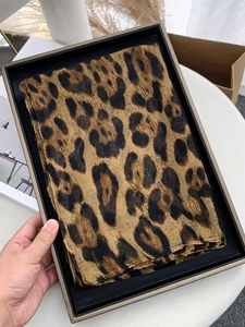 Leopard print voile scarf presented in a premium black gift box with gold trim detail