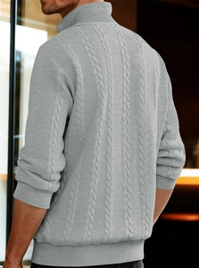 Detailed back view of grey cable knit sweater showing intricate weave and texture