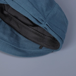 Short brim navy blue cotton linen cap with breathable fabric and detailed stitching
