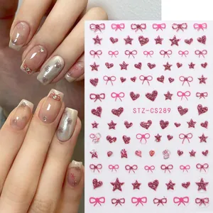 Detail of pink bow and star glitter nail stickers showing application and STZ-CS289 sheet