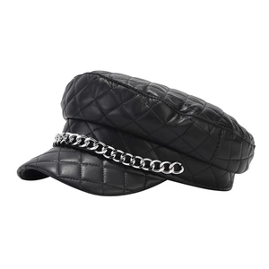 Chic black quilted leather newsboy cap with a stylish silver metal chain decoration