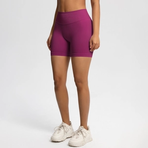 Close-up of seamless magenta gym shorts with ribbed waistband and moisture-wicking fabric