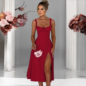 Detailed view of red midi dress featuring corset boning, drawstring bust, and high side slit