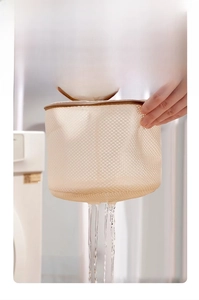 Detail of thickened mesh laundry bag with fine honeycomb texture and durable brown zipper