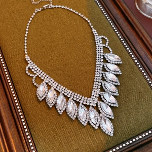 Exquisite silver necklace with marquise and round cut rhinestones in leaf shapes