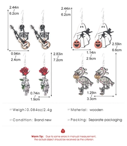 Detailed view of Halloween wooden earrings showing skulls and ghost patterns with size specs