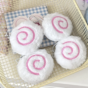 Cute Narutomaki plush charm in a yellow basket with soft pink and white fur texture