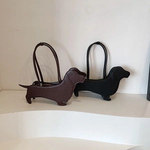 Minimalist dachshund-shaped leather tote bag in coffee and black with long top handles