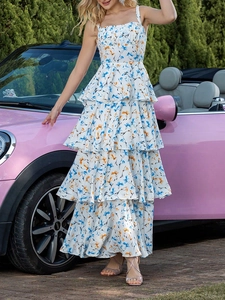 Floral tiered chiffon maxi dress with spaghetti straps shown next to a vintage car