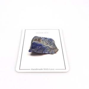 Natural lapis lazuli stone specimen on white card with handmade with love text