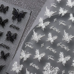 3D butterfly nail art stickers with delicate wing patterns in black and white styles