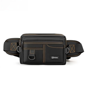 Detail of black tactical waist bag featuring contrast orange stitching and multi-pocket design