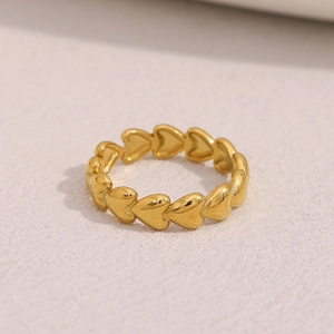 Detailed view of the 18K gold plated stainless steel ring with continuous heart design