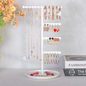 White multi-tier jewelry stand with metal tray for organizing necklaces and earrings