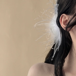 Elegant white ostrich feather hair claw clip for women's sophisticated updo hairstyles