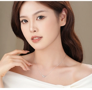 Close-up of S925 silver butterfly necklace with zircon micro-paving on model neck