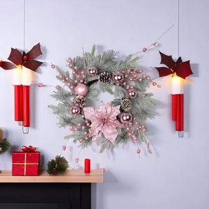 Frosted pine Christmas wreath with pink baubles and glitter poinsettias for home decor