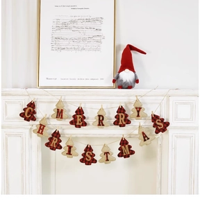 Detail of Christmas tree bunting with red plaid and burlap letters on white mantel