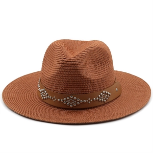 Classic brown woven straw hat featuring a leather band with silver metal stud details