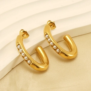 Close-up of 18K gold-plated U-shaped stainless steel earrings with pearl inlays