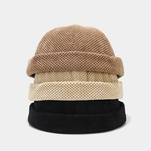 Classic knitted docker hats in brown, beige, and black with waffle texture for winter