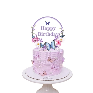 Pink floral and butterfly Happy Birthday cake topper on a purple wave cake