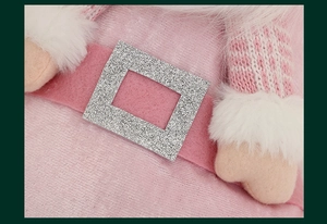 Macro detail of pink sequins, silver glitter buckle, and soft white faux fur trim on stocking