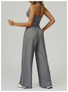 Rear view of grey yoga bra and high waist wide leg pants set showing halter back design