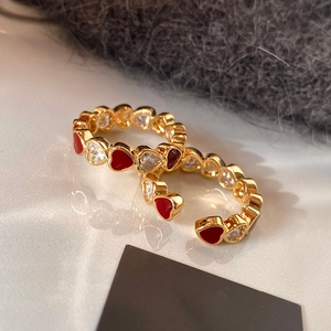 Gold plated open heart rings set with red enamel and white zircon stones