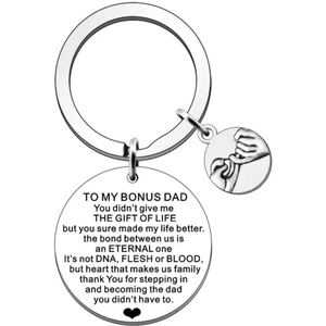 Detail of silver stainless steel keychain with engraved emotional message for bonus dad