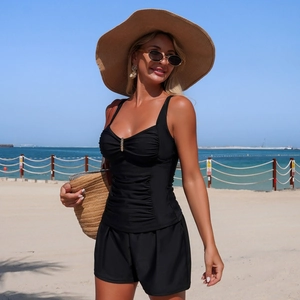 Women's black tankini set with pleated top and loose shorts for beach vacation wear