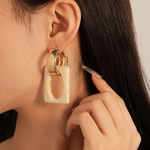 Fashionable resin geometric hoop earrings with gold metal and cream rectangular pendants