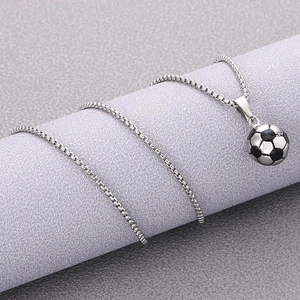 3D silver soccer ball pendant necklace with box chain on a cylinder display stand