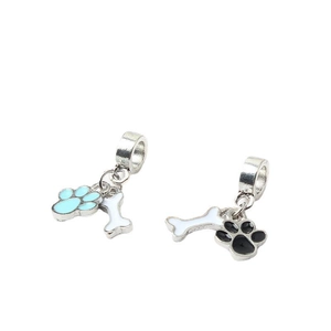 Close-up of alloy pet paw and bone charms with blue and black enamel for bracelets