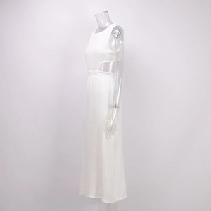 Detail view of white sleeveless dress showing waist cut-outs and pleated texture