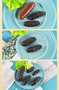 Detailed view of realistic sea cucumber models in various sizes on a blue plate