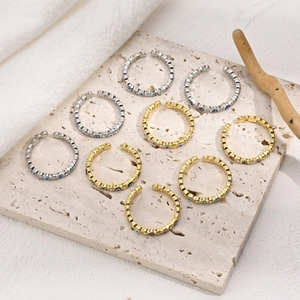 Set of 9 evil eye brass rings with zircon crystals in gold and silver finish