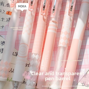 Macro shot of stylish pink gradient gel pens featuring trendy patterns and matte texture