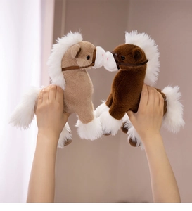 Detail of plush pony toys showing soft faux fur manes and delicate brown harness features