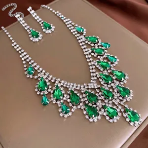 Luxury water drop jewelry set featuring emerald green gems and silver diamond necklaces