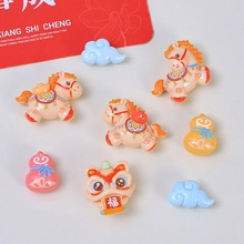 Macro shot of assorted resin charms featuring dancing lions, horses, and lucky clouds