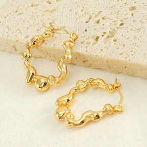 Minimalist gold plated titanium steel hoop earrings with unique irregular lava texture