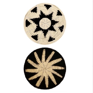Set of 2 bohemian woven seagrass wall decor plates with black starburst geometric pattern