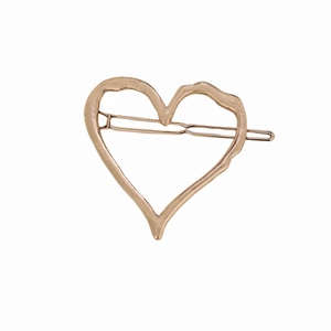 Irregular hollow heart hair clip in rose gold finish with minimalist organic lines
