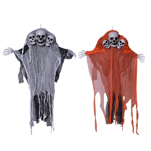 Detail of hanging Halloween skeletons with black, white, and orange tattered gauze robes
