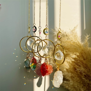 Five hanging natural crystal suncatchers with gold metal chains and faceted glass prisms